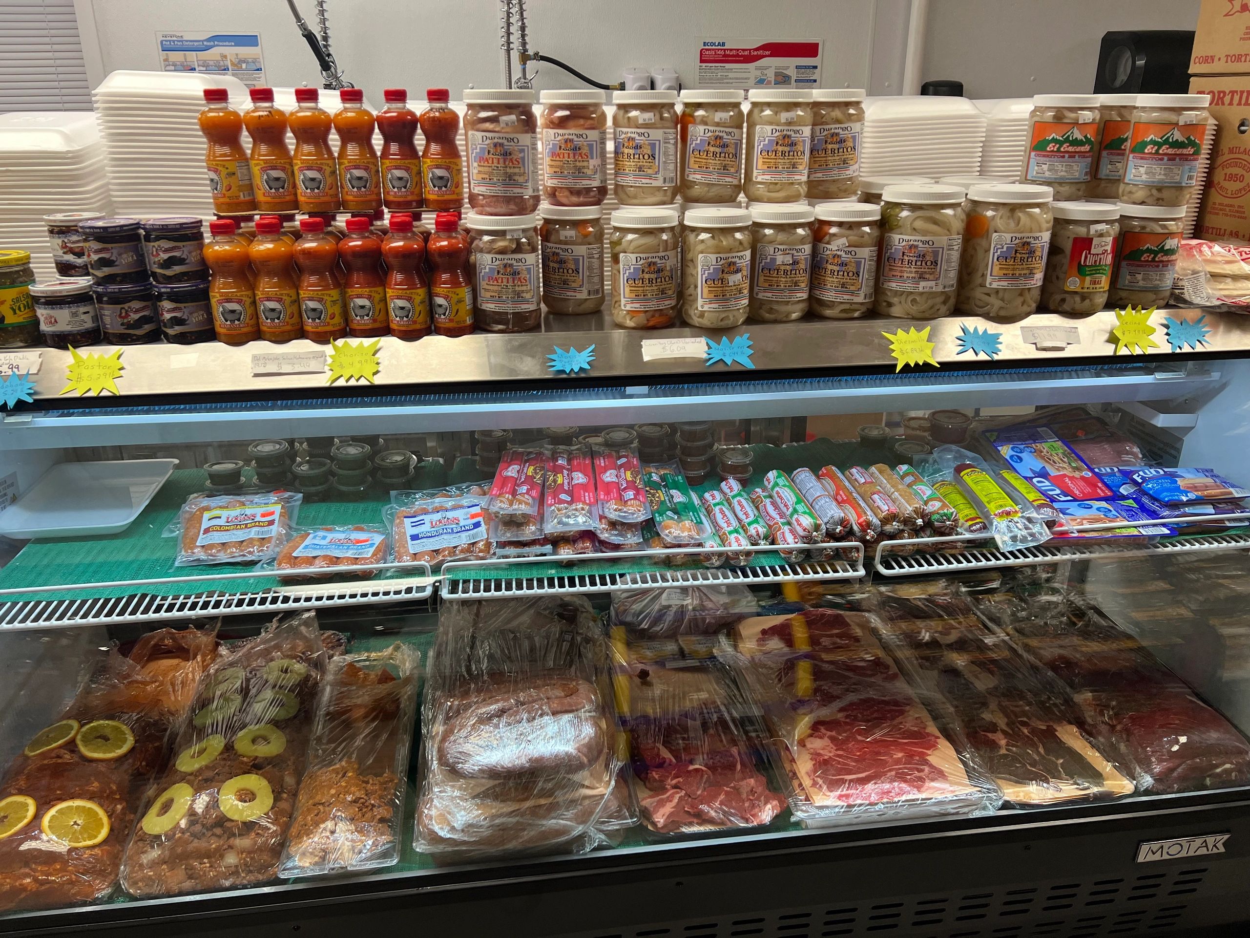 Butcher shop display case with fresh meats