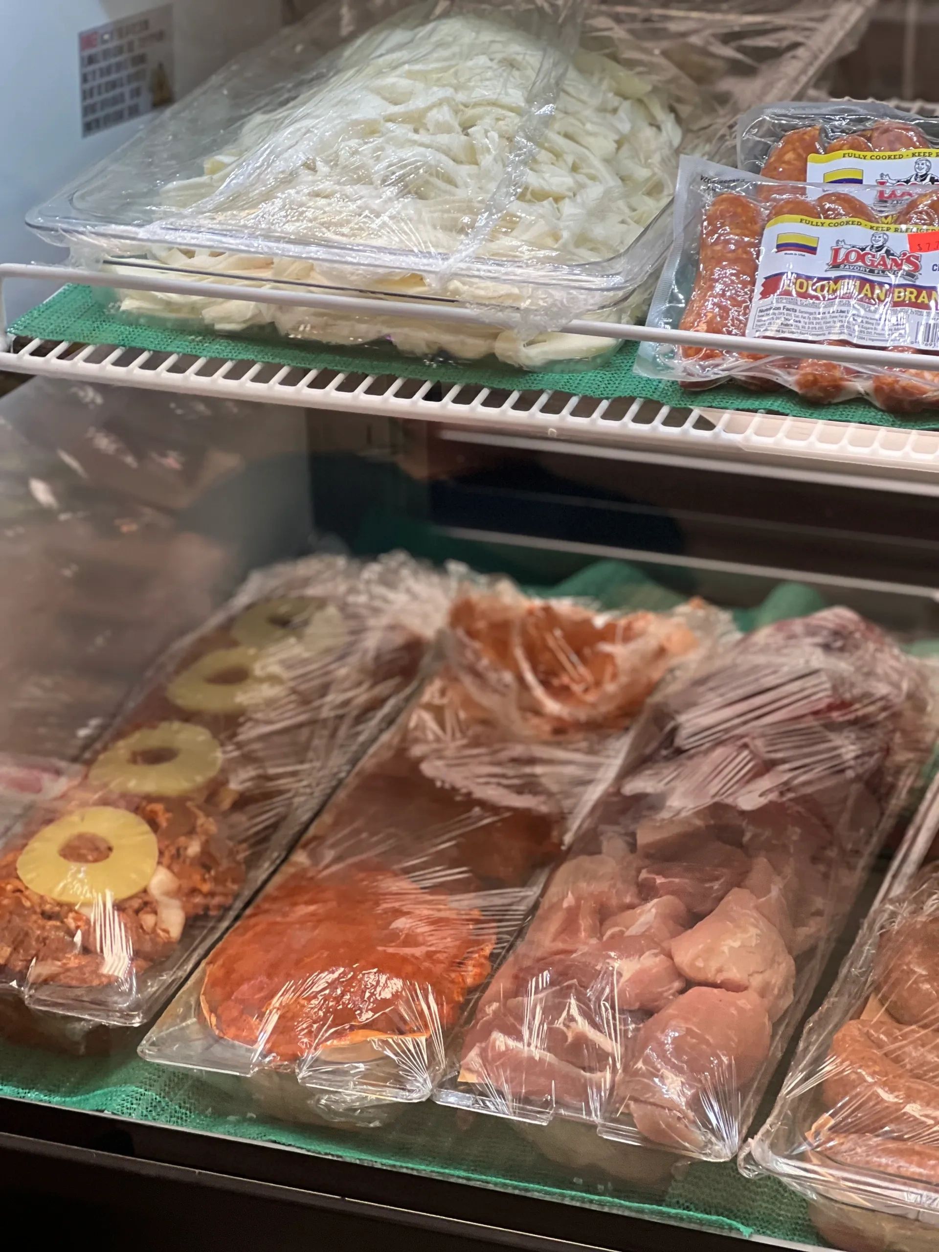 Refrigerated deli case with packaged meats